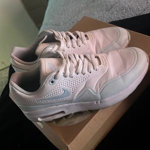 White and blue Nike shoes used